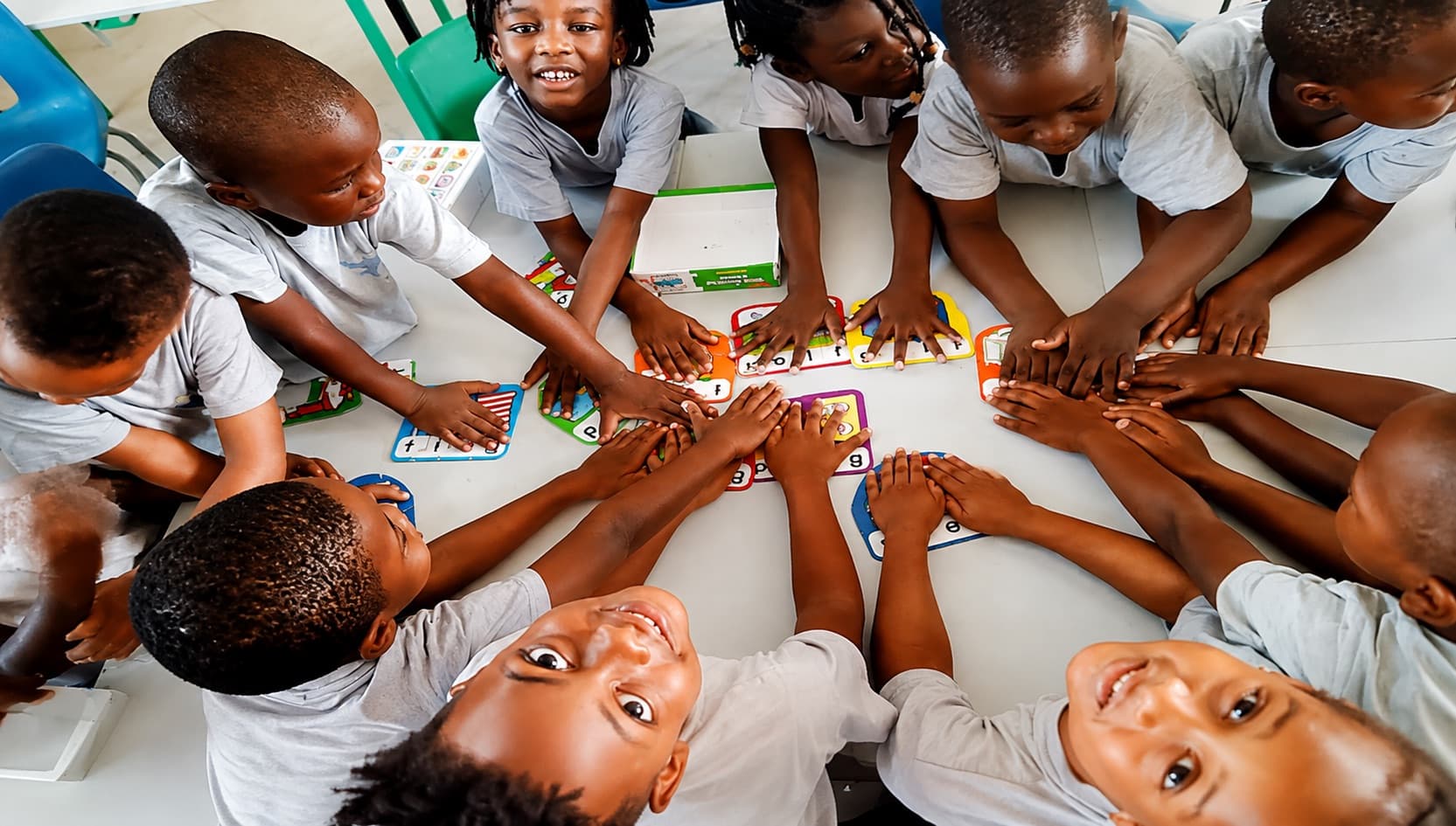 Primary pupils working together during a classroom activity at Milestones Academy
