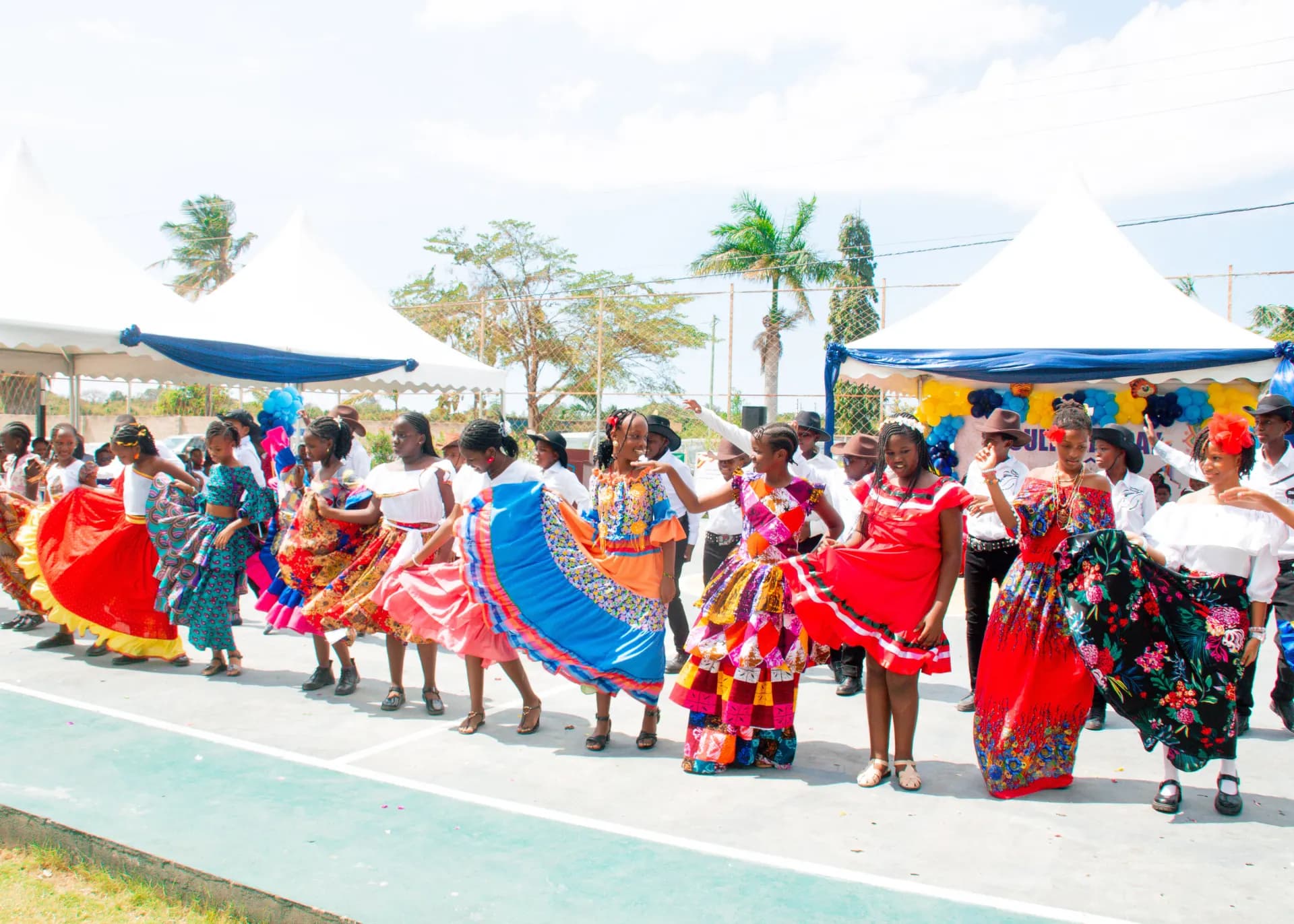 Students performing a colourful cultural dance.