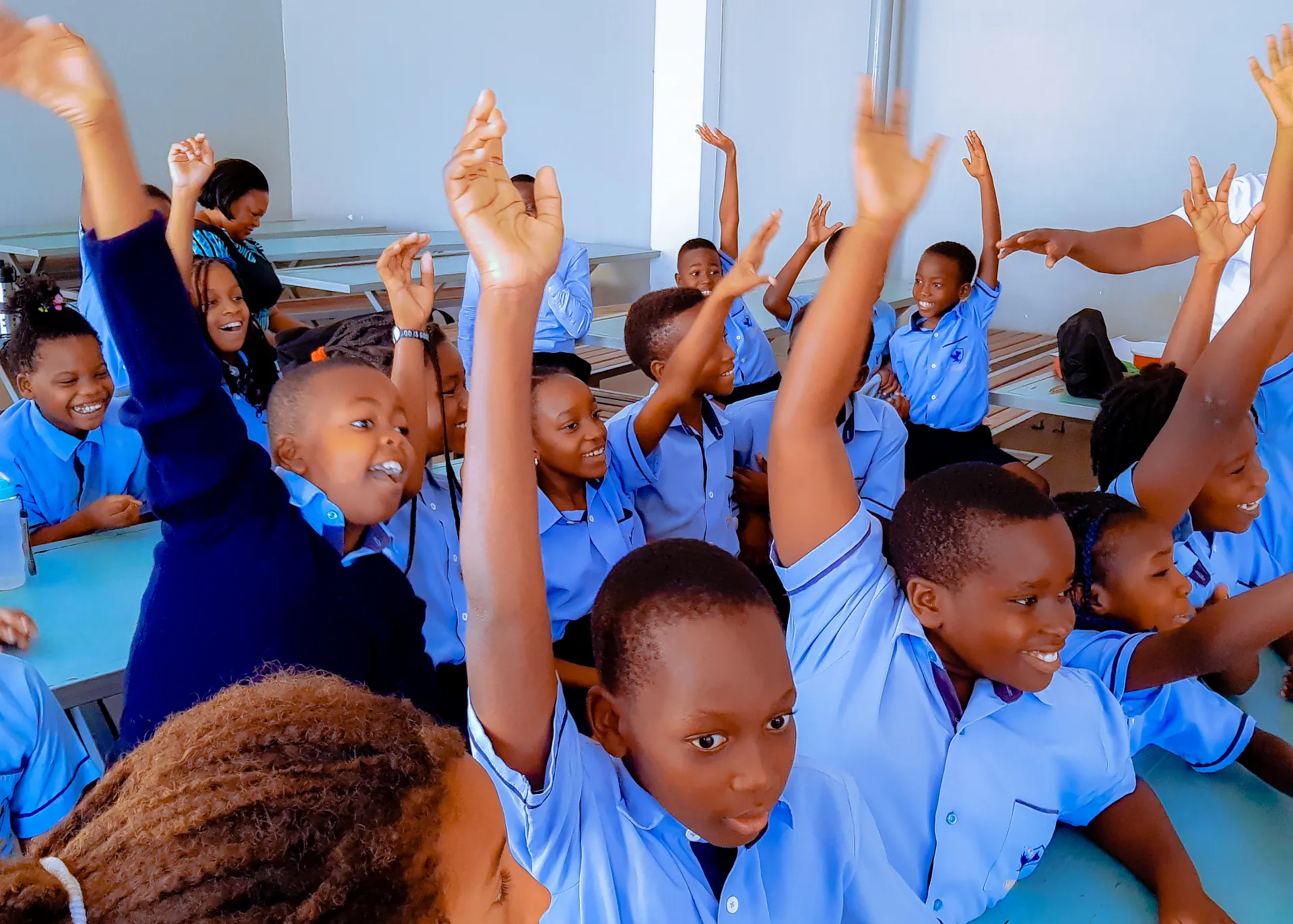 Learners taking part in a lively classroom activity.