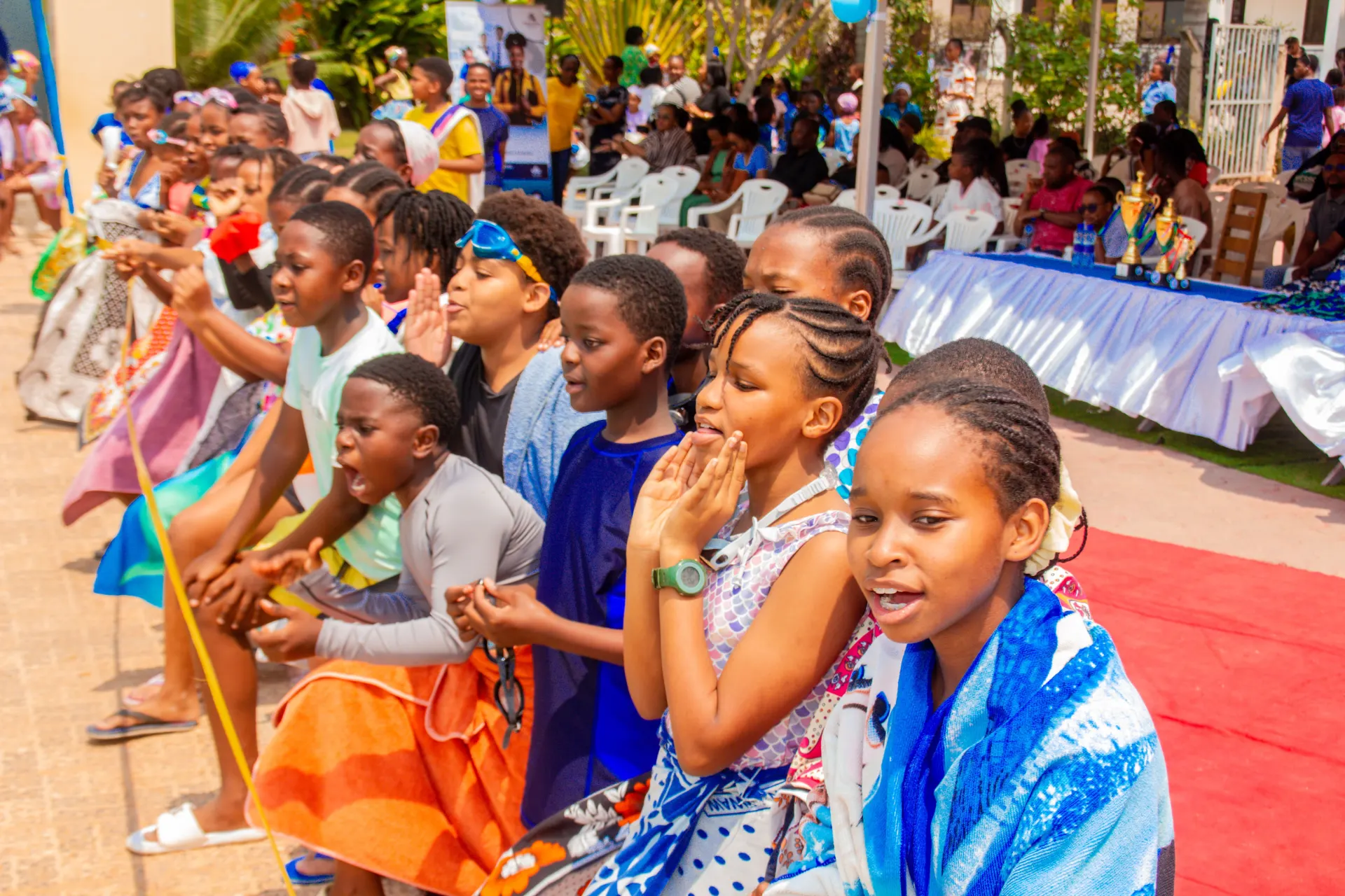 Learners cheering on their swimming teams.
